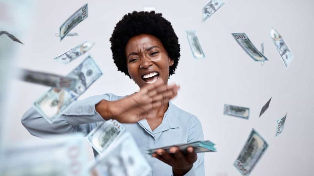 happy woman throws cash