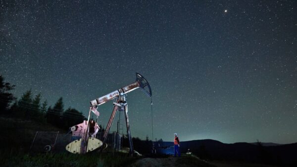 oil pump jack under night sky
