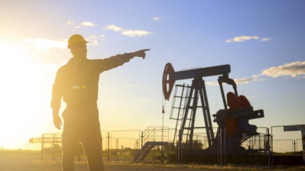 Oil industry worker works in oilfield
