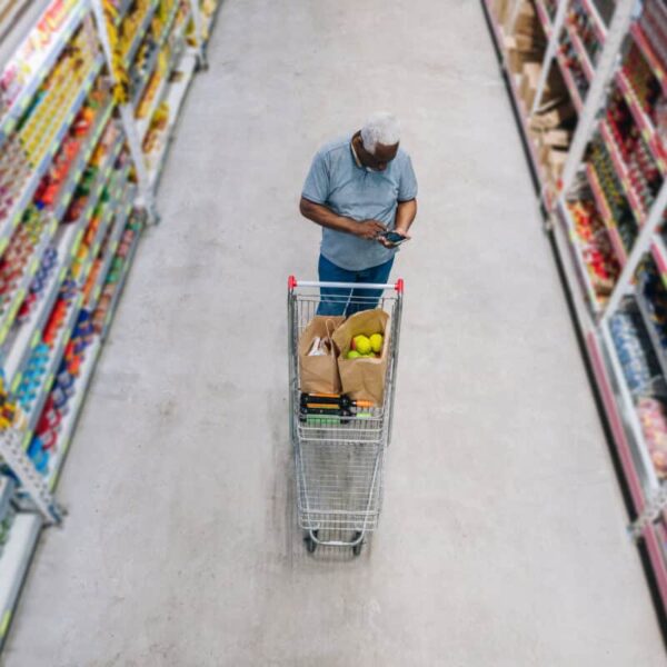 man shops at grocery store