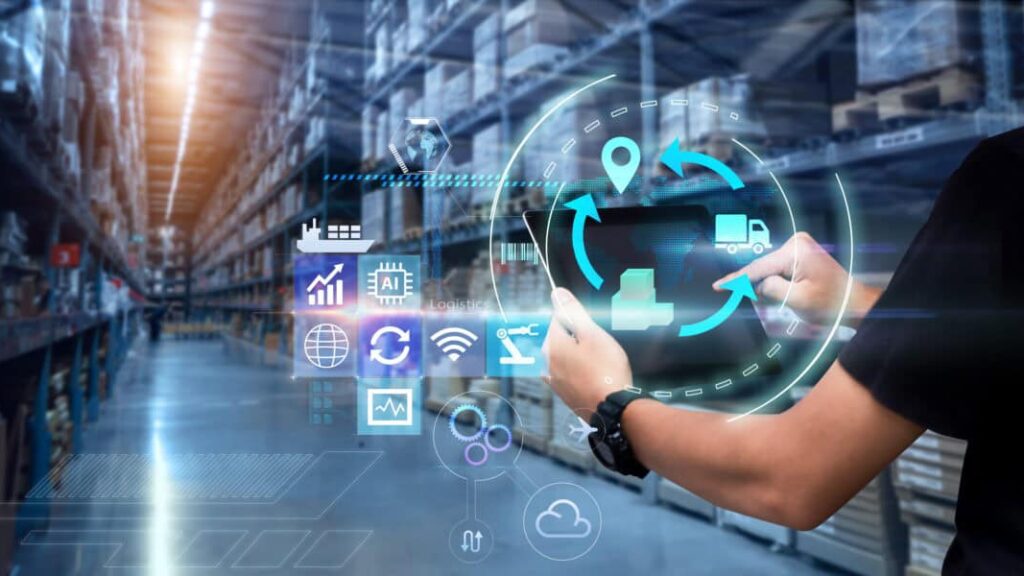 Person uses a tablet in a blurred warehouse as background