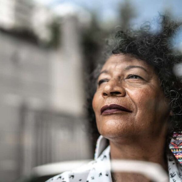 woman gazes forward out window to future