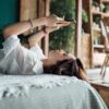 woman relaxes with phone